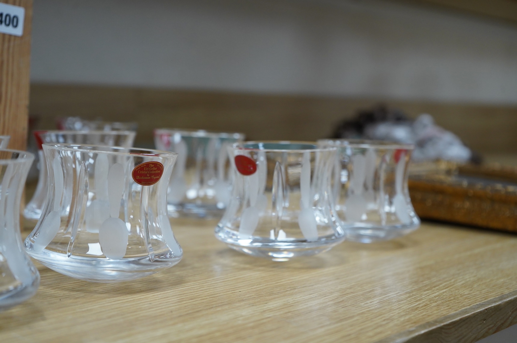 A collection of twenty five Uri Geller Crystal Collection whisky tumblers by Dickenson Crystal, 9cm high